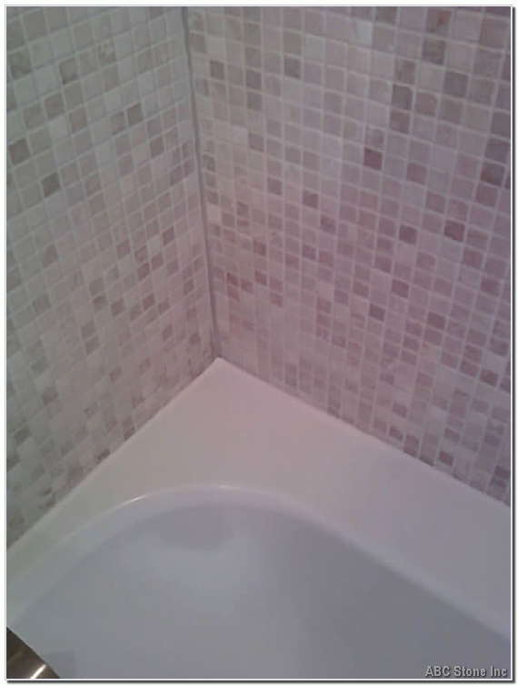Freshly applied caulk on a bathtub