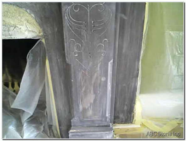 Image of slate fireplace in need of repair