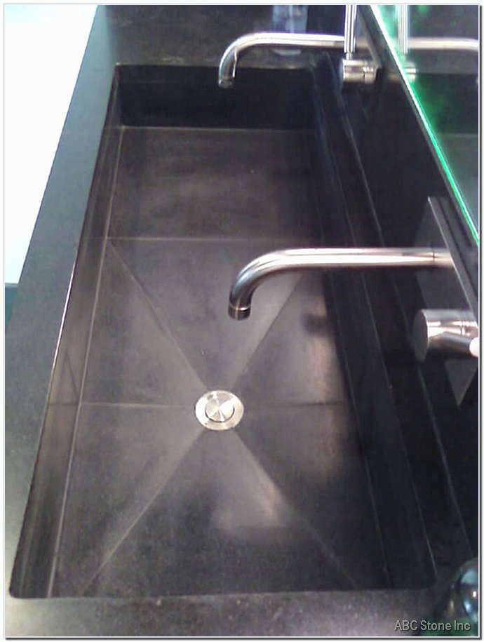 Black Granite Sink. Grout Repair