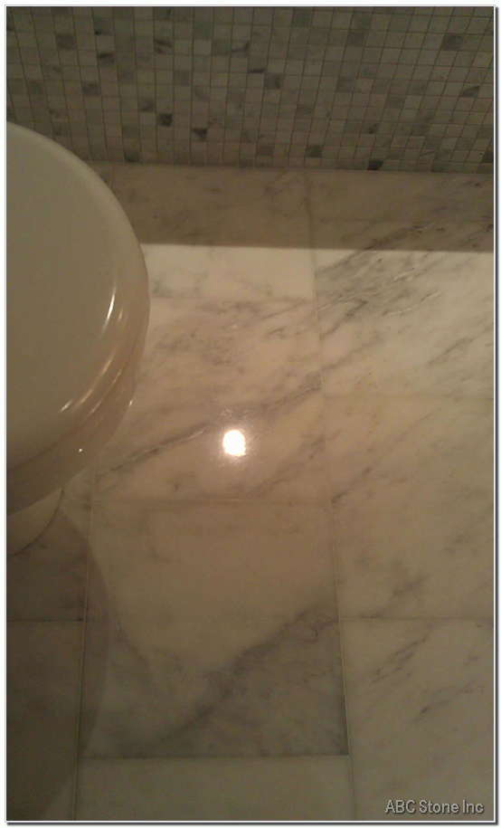 Carrara bathroom floor before and after transformation