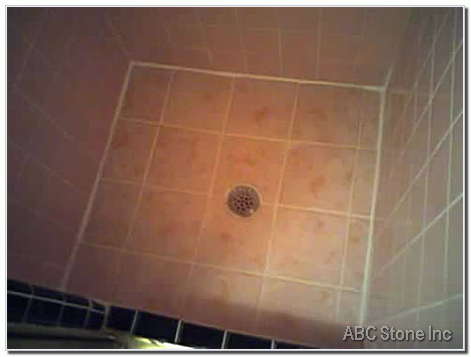 Image of newly grouted and recaulked ceramic tiles in a shower