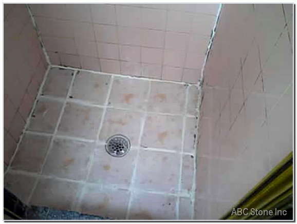Molded ceramic shower tiles before cleaning