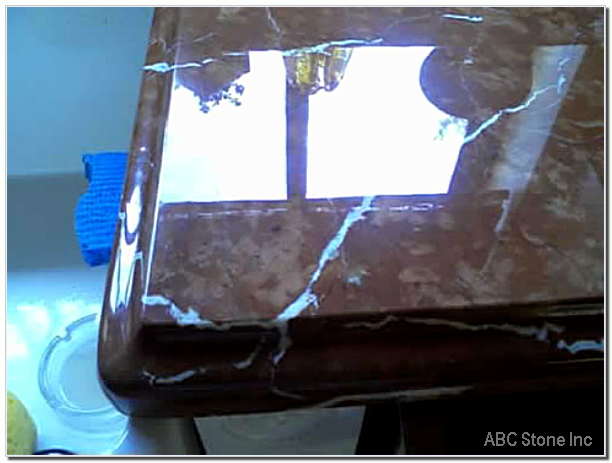 Polished marble surface with etch marks removed