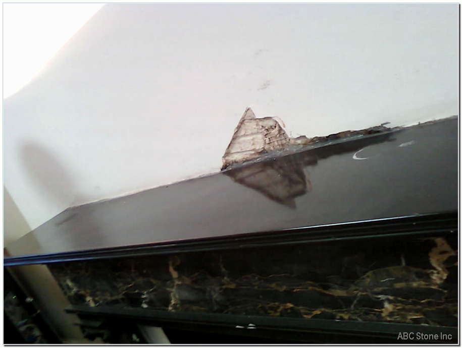 Repaired top slab of black slate fireplace