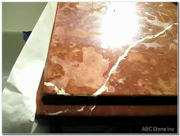Marble top with stains before restoration work