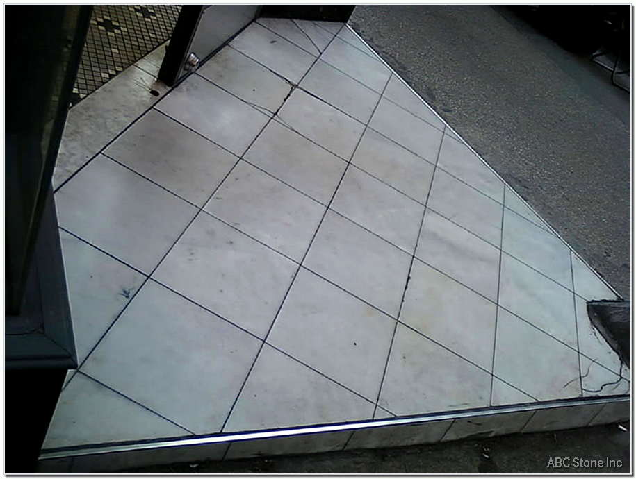 Tiled entrance of a store before renovation