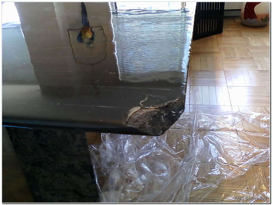Chipped corner of a laminated table