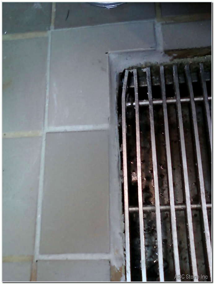 Image of new tiles being installed on the floor