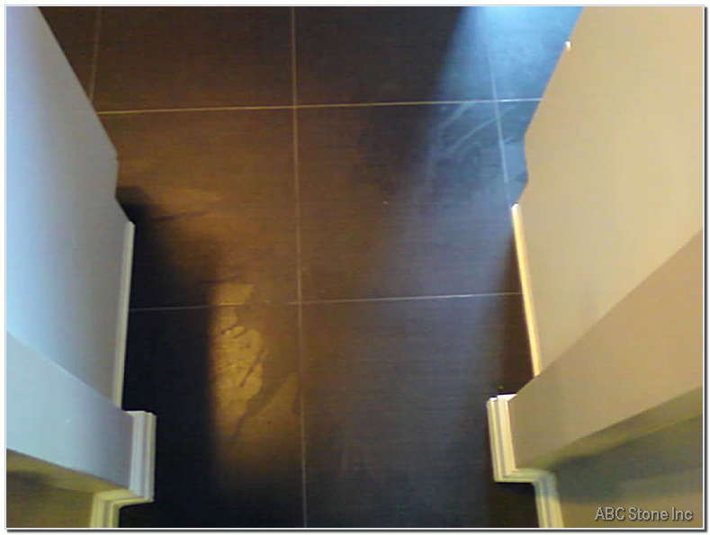 Repairing porcelain tiles on a floor