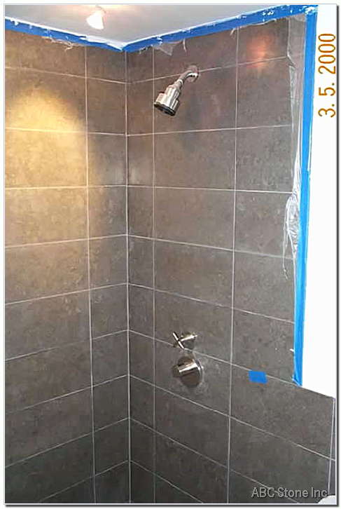 Bathroom shower walls with honed surfaces