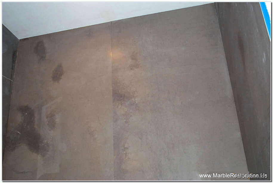 Repaired honed tiles on walls