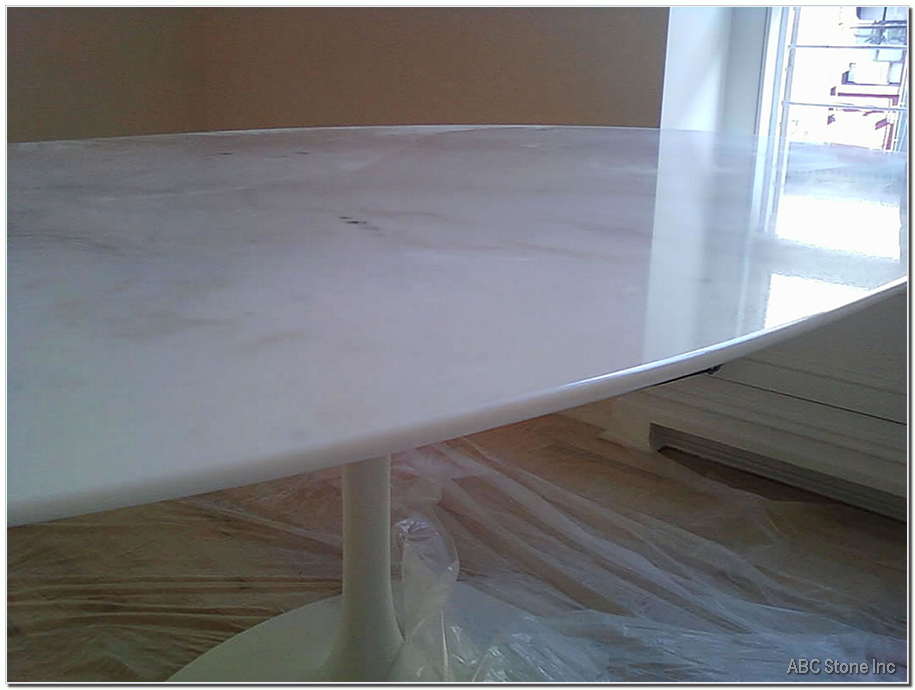 White tabletop with repaired chips